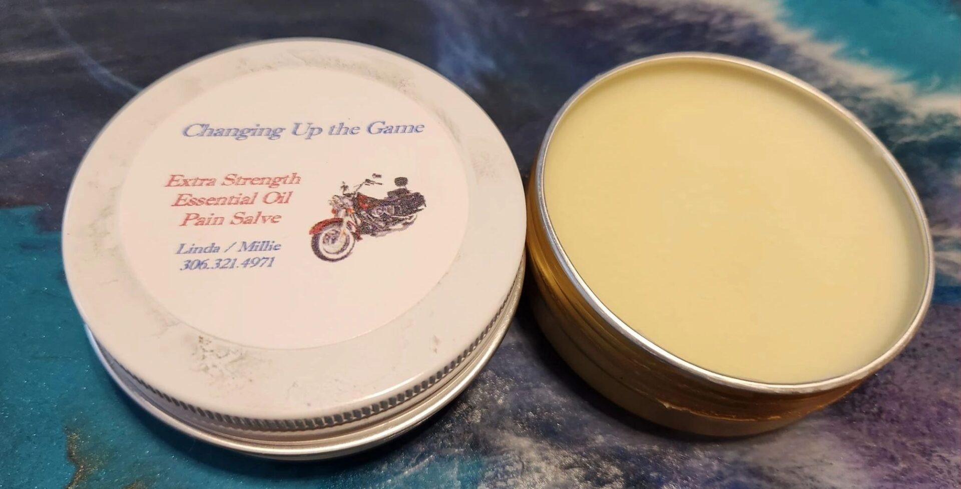 A tin of cream sitting on top of a table.