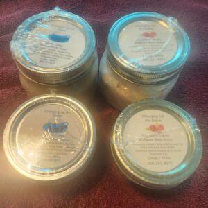 A group of four jars with different types of creams.