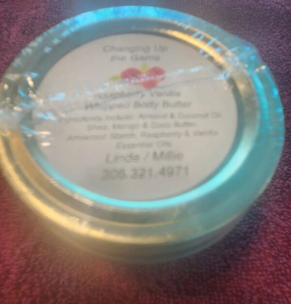 A close up of a package of body butter